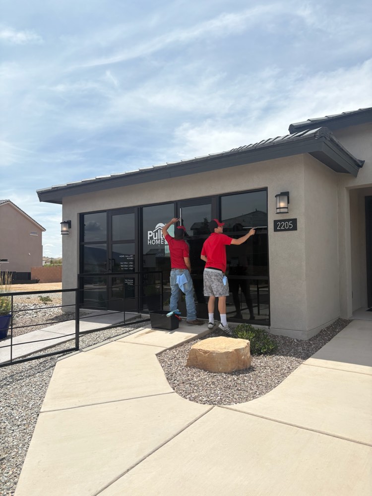 Sandia Window Cleaning crew cleaning storefront glass in Santa Fe