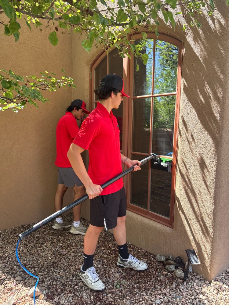Clean windows on an adobe home in the Santa Fe area